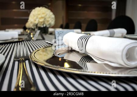 Table setting in black and white for gala dinner Stock Photo