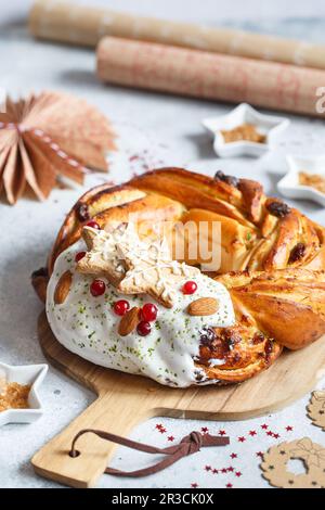Sweet Bread Wreath decorated with stars cookies. Honey brioche garland with dried berries and nuts. Stock Photo