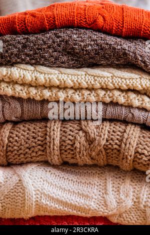 Pile of woolen clothes close up as a background Stock Photo