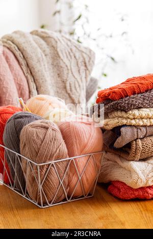 Close up of yarn balls at the white basket Stock Photo