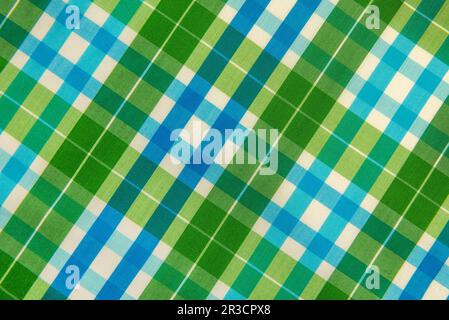 The texture of linen fabric in a large green cell. Scottish tailoring material Stock Photo