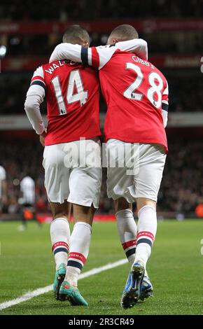 Arsenal's Theo Walcott celebrates scoring his sides seventh goal with his team mates Arsenal's Kieran Gibbs to give them a 7:3 lead over NewcastleArse Stock Photo