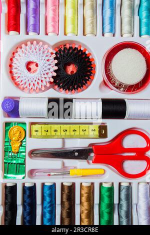 Set of sewing tools in white box Stock Photo