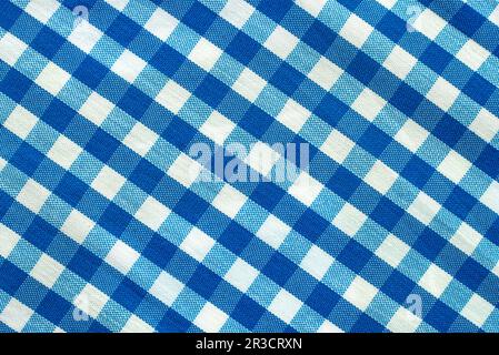 The texture of linen fabric in a large cage of blue and white. Scottish tailoring material Stock Photo