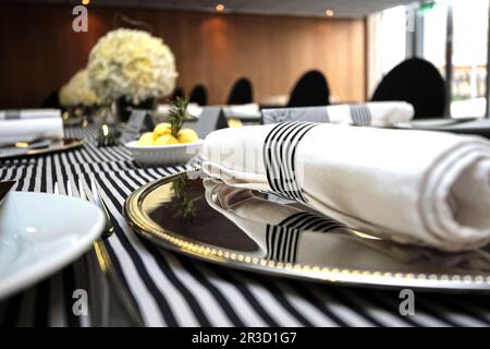 Table setting in black and white for gala dinner Stock Photo