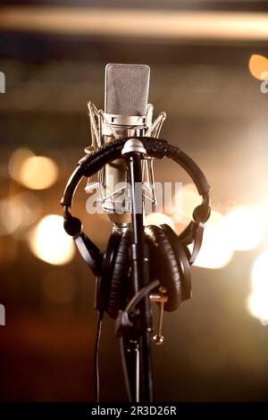 Headphones and Condenser Microphone in a Music Recording Studio Stock Photo