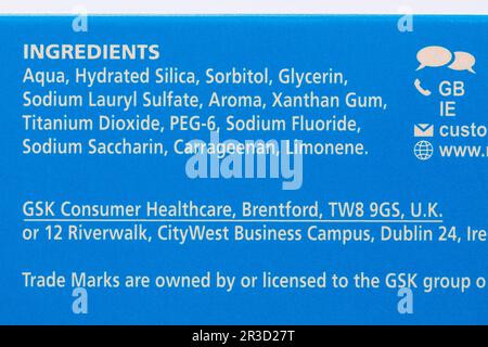 Toothpaste ingredients listed on box of Macleans fresh mint toothpaste Stock Photo