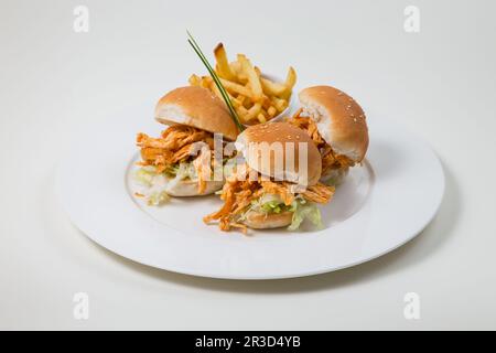 Chicken Burger and Fries on a white plate on a white background isolated Stock Photo