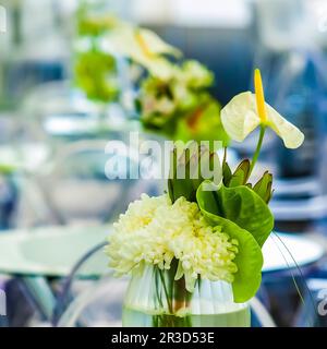 White flowers on a table setting for event or party Stock Photo