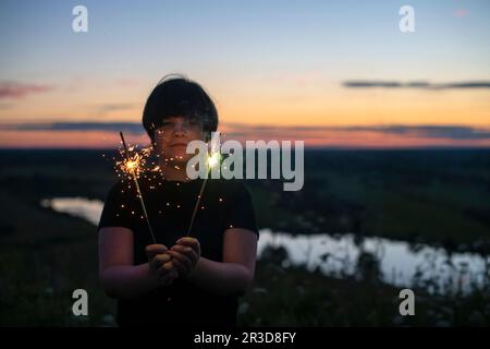Usa Celebration - Hands Holding Sparklers And American Flag At Sunset ...