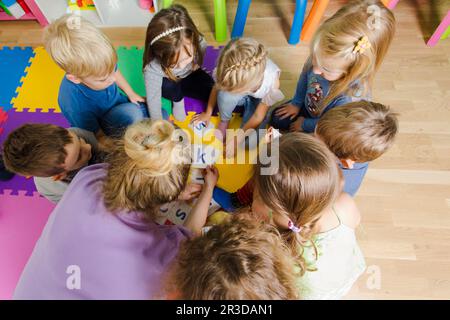 Educational group activity at the kindergarten or daycare Stock Photo