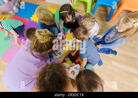 Educational group activity at the kindergarten or daycare Stock Photo