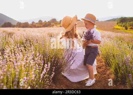 Mother with her son at the lavender field Stock Photo