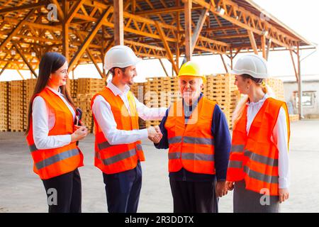 Colleagues are greeting their co-worker with retirement Stock Photo