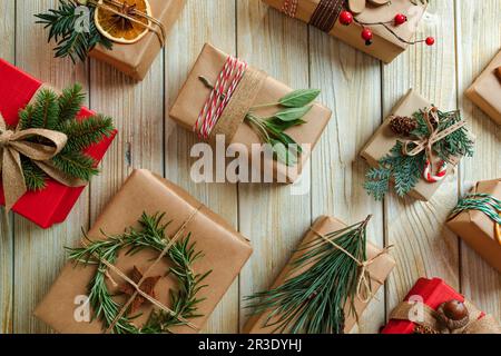 Wrapped Christmas presents with decoration in snow. Flat lay of