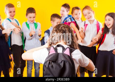 School girl being bullied by classmates. School bullying concept Stock Photo