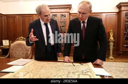 Moscow, Russia. 23rd May, 2023. Russian President Vladimir Putin reviews a historic map with Constitutional Court Chairman Valery Zorkin, left, at the Kremlin, May 23, 2023 in Moscow, Russia. Credit: Mikhail Klimentyev/Kremlin Pool/Alamy Live News Stock Photo