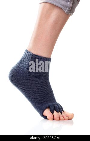 Feet with yoga toe separator socks on white background Stock Photo - Alamy
