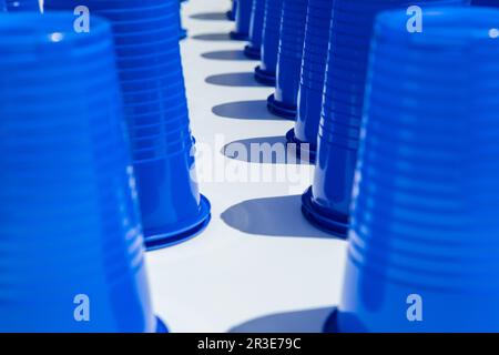 Blue Plastic Drinking Cups in rows background Stock Photo