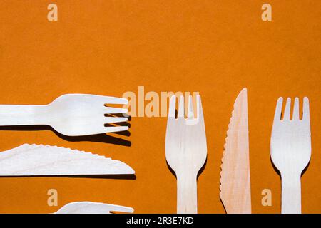Eco friendly fast food containers. Wooden forks and knives. Eco friendly disposable tableware. Used in fast food, restaurants, t Stock Photo