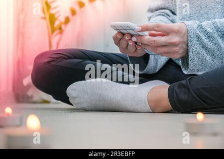 Young millennial blonde woman doing yoga exercise stretching fitness at  balcony home. Mindfulness meditation. Relax breathe easy pose gym healthy  lifestyle concept. Self-isolation is beneficial Stock Photo - Alamy