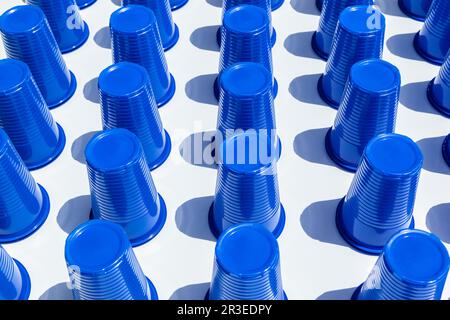 Blue Plastic Drinking Cups in rows background Stock Photo