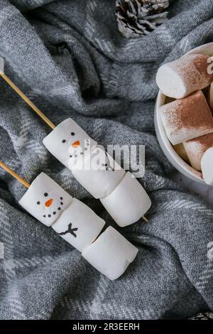 Two happy funny marshmallow snowmen. Marshmallow friends. Diy. Sweet treat for kids funny marshmallow snowman. Christmas winter Stock Photo