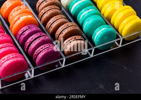 Colorful macarons cookies in the acrylic box Stock Photo