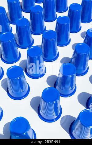 Blue Plastic Drinking Cups in rows background Stock Photo