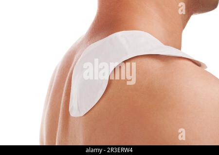 Heat patch on mans shoulder. Stock Photo