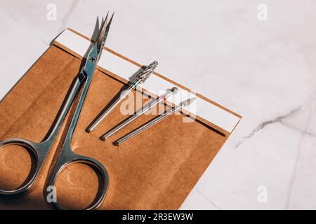 Clean manicure instruments. Manicure set in paper heat dry bag for sterilization. Sterilization of instruments healthcare concep Stock Photo