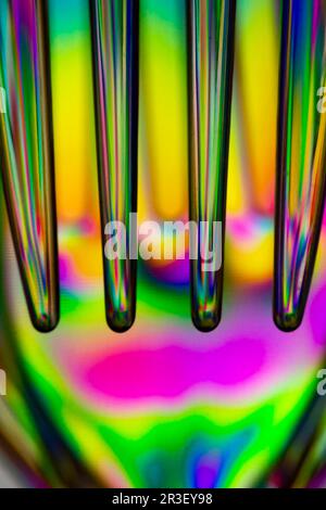 Polarized light through clear plastic utensil abstract Stock Photo