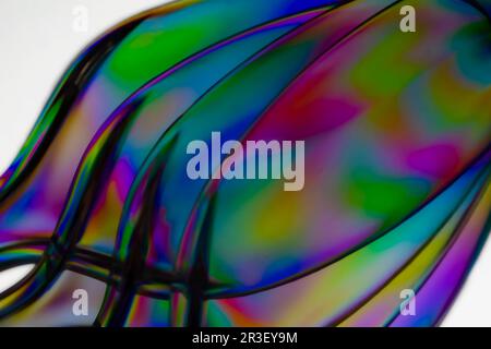 Polarized light through clear plastic utensil abstract Stock Photo