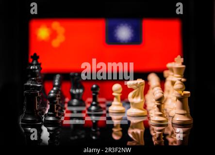 Conceptual image of war between China and Taiwan using chess pieces and national flags Stock Photo