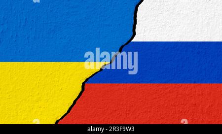Conceptual image of war between Russia and Ukraine with cracked wall with national flag Stock Photo