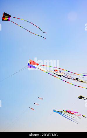 Colorful kites fly over the beach, May 13, 2023, in Long Beach, Mississippi. Long Beach is a seaside town located on the Mississippi Gulf Coast. Stock Photo