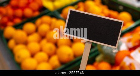 Blank Black billboard against groceries shop Empty mockup template Blackboard label at shopping mall store. Shopping center. Dep Stock Photo