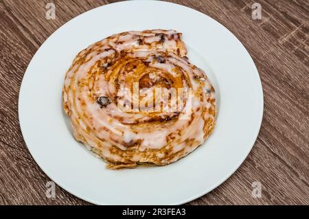 A fresh raisin bun from the bakery Stock Photo