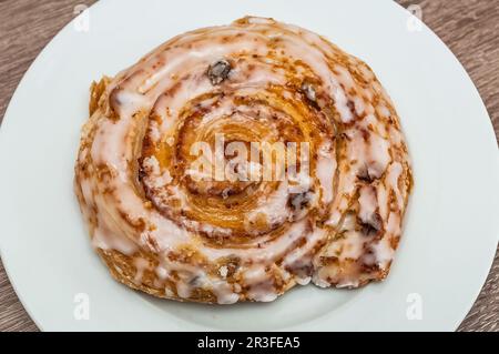 A fresh raisin bun from the bakery Stock Photo