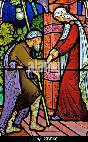 Corporal Acts of Mercy window, stained glass by Frederick Preedy, 1868, , sheltering the homeless, Gunthorpe, church, Norfolk, England Stock Photo