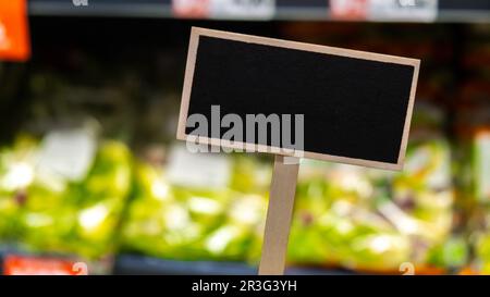 Blank Black billboard against groceries shop Empty mockup template Blackboard label at shopping mall store. Shopping center. Dep Stock Photo