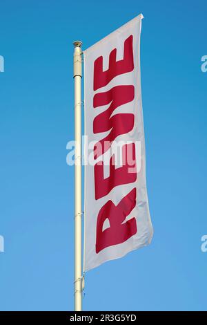 Flag in front of the new central warehouse of the German food retailer Rewe in Magdeburg Stock Photo