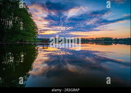 Rahmer See at sunset and reflection of the clouds in the water, Muehlenbecker Land, Brandenburg, Germany Stock Photo