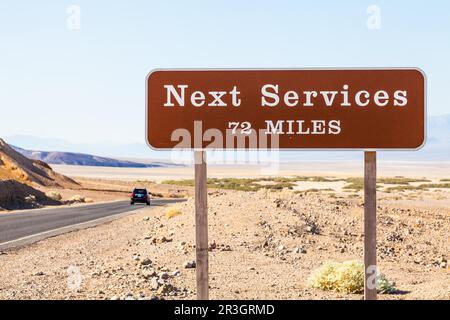 Death Valley, USA. Next service streetsight useful for travel concept Stock Photo