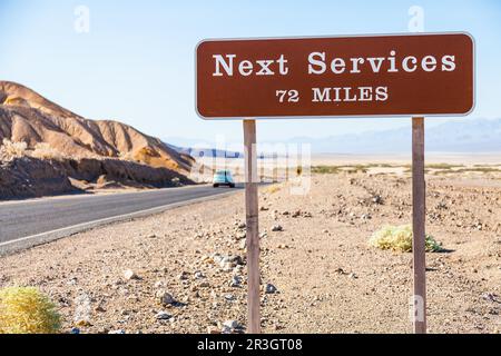 Death Valley, USA. Next service streetsight useful for travel concept Stock Photo