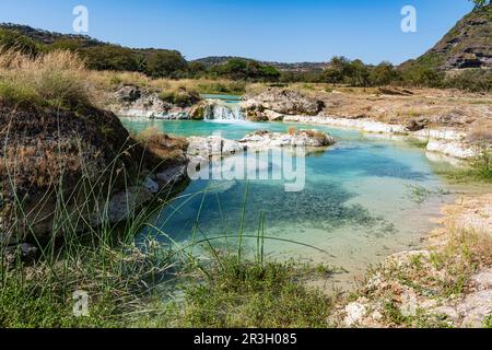 Turquoise river, Wadi Darbat, Salalah, Oman Stock Photo