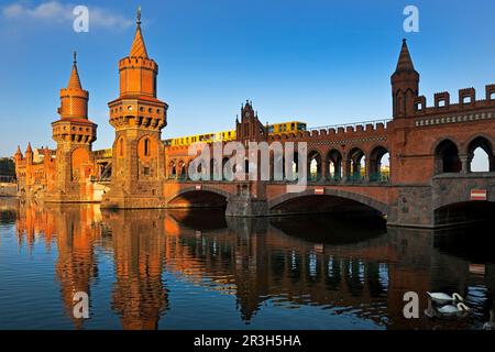 Oberbaum bridge over the Spree river with yellow subway, Berlin, Germany, Europe Stock Photo