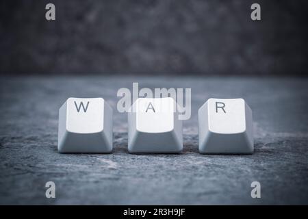 Computer keyboard keys arranged to spell WAR word Stock Photo