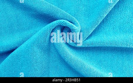 Wrinkled blue microfiber cloth texture of microfiber towel closeup Stock Photo