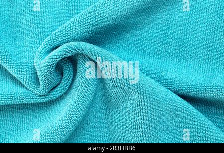 Wrinkled blue microfiber cloth texture of microfiber towel closeup Stock Photo